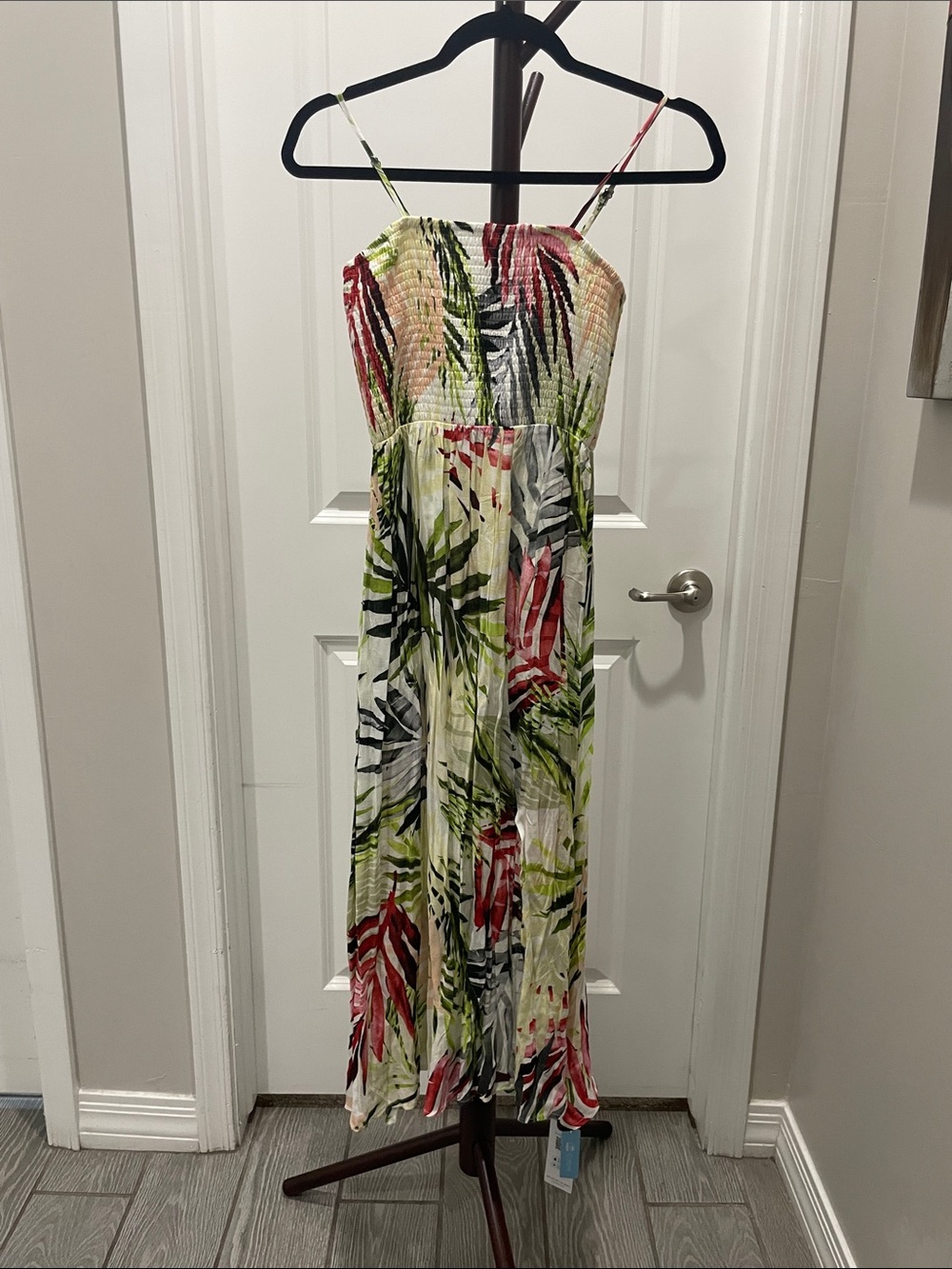 Tropical Print Smocked Sundress in Multi. Flowing material with side split